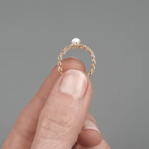 Thin gold ring with a pearl